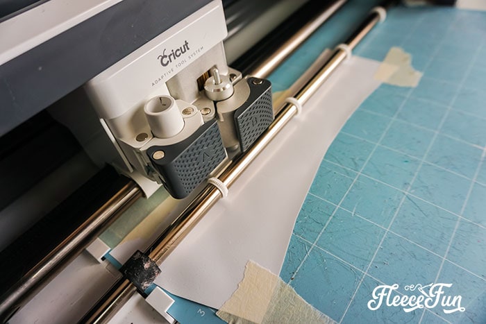 Prepping a love sign for the Valentine wreath DIY with fleecefun's free template and tutorial.
