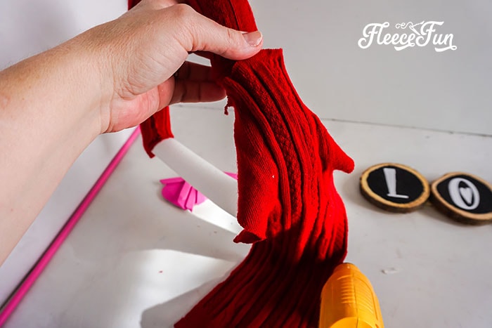 covering the other side of the wreath with the red sweater