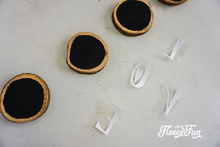 DIY Valentine wreath love sign preparation guided by fleecefun's step-by-step tutorial.