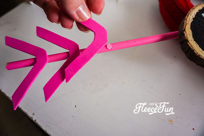 Creating an adorable arrow accent for the Valentine wreath using fleecefun's tutorial.