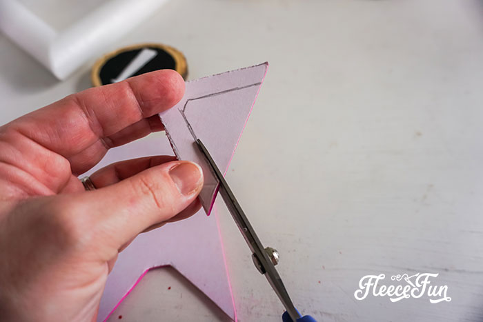 adding v shapes to the pink craft foam