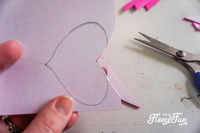 cutting two small hearts