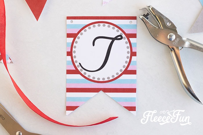 placing holes in the banner pieces
