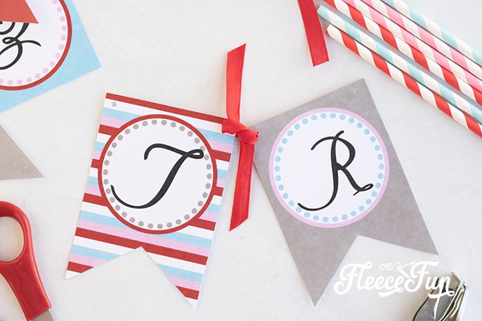 DIY Valentine's Day banner assembly finalized with decorative ribbon from fleecefun