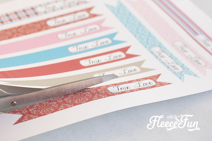 DIY straw flags for Valentine’s Day party drinks prepped with fleecefun printable designs