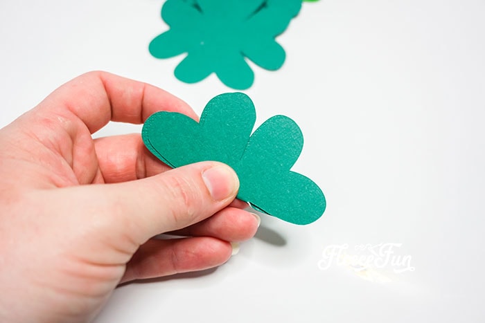 Step 3 involves folding and shaping clovers to achieve a 3D effect using fleecefun’s free tutorial.