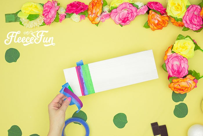 Learn how to paint striped designs on your Easter table decor with fleecefun
