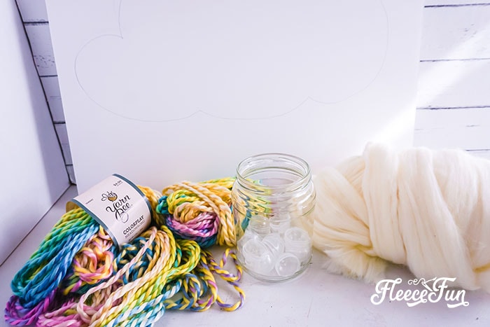 Preparing the cloud backing for a DIY nursery wall hanging with fleecefun free template and tutorial