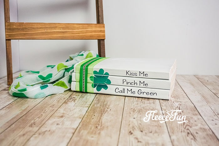 Displaying the finished St. Patrick’s Day book stack decoration in a cozy home setting with fleecefun and free template and tutorial
