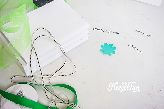 Painting books for a creative DIY St. Patrick's Day decor project with fleecefun and free template and tutorial