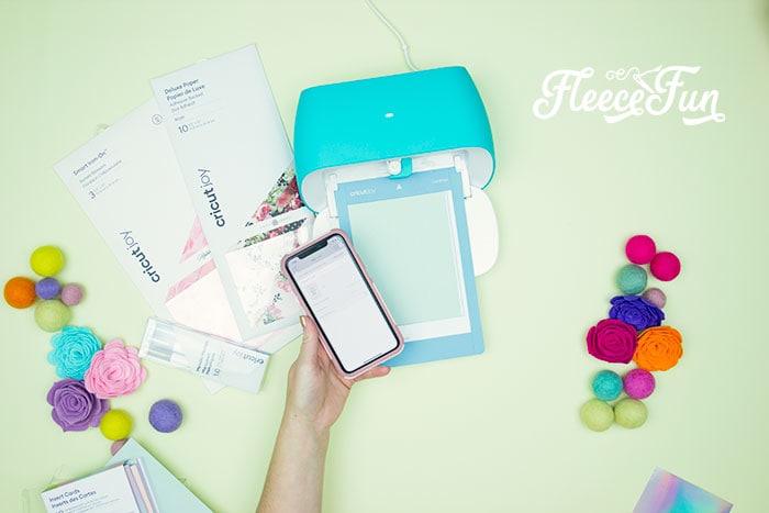 Card being cut out . 3 Last Minute Gifts with a Cricut Joy - ideas on how you can make a cute gift set in under 20 minutes with a Cricut Joy! Perfect for Cricut beginners.