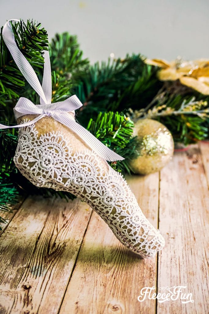 This delicate Ballet Slipper Handmade Ornament Tutorial is inspired by the Nutcracker Suite! Free PDF pattern and SVG file with step by step directions.