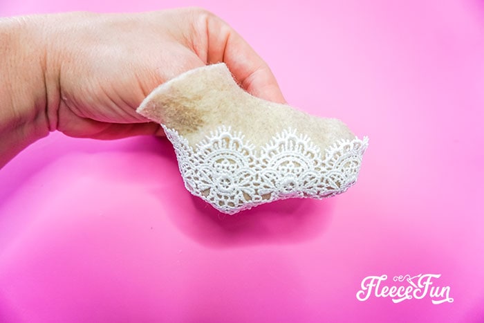 Turning the sewn Ballet Slipper ornament right side out, following fleecefun's step-by-step tutorial.