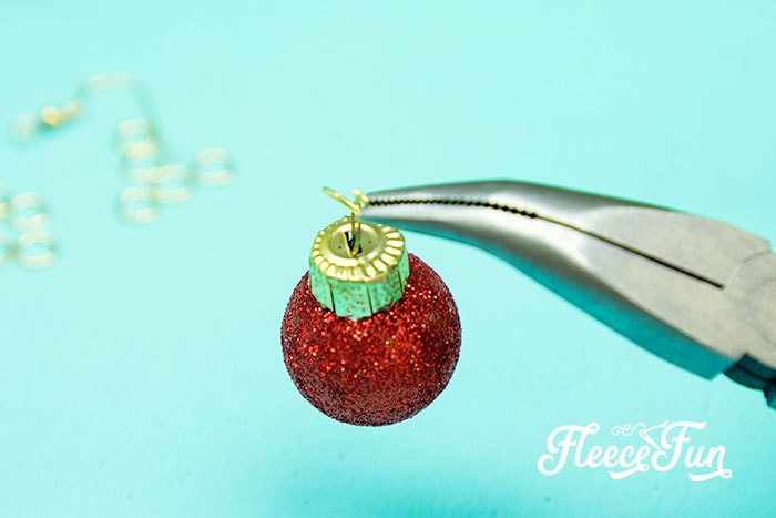 Add ornament to jump ring. Create DIY Christmas earrings using fleecefun free template and tutorial for an easy project