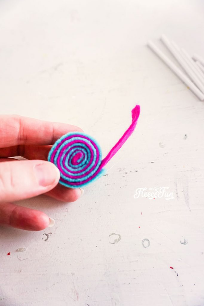 Rolled felt. I love the look of these DIY Felt Candy Christmas Tree Ornaments.   Fast to make, they add a little whimsy and fun to your tree - while not adding calories to your waistline.