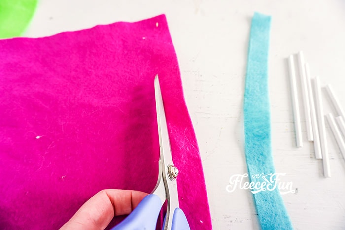 Cut the felt. I love the look of these DIY Felt Candy Christmas Tree Ornaments.   Fast to make, they add a little whimsy and fun to your tree - while not adding calories to your waistline.