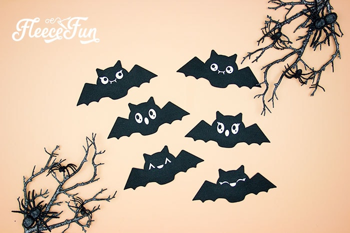 Step-by-step guide to stringing bats for Halloween garland with fleecefun's free template.