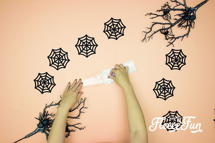Step-by-step guide to cutting bats for Halloween garland with fleecefun free template.