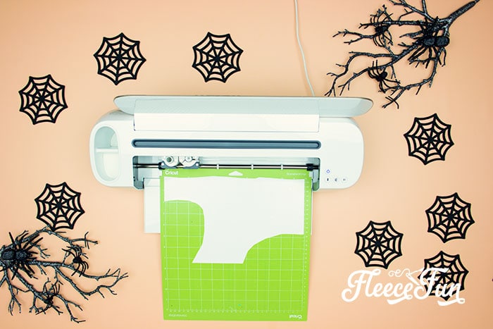 Creating Halloween garland by cutting bats with fleecefun's free template and tutorial.