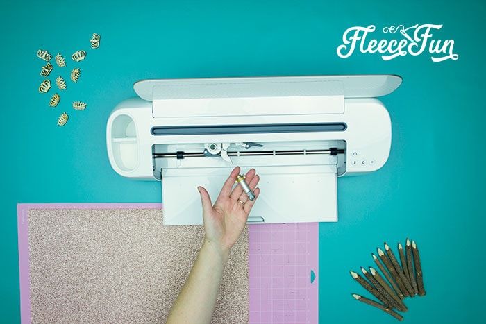 Cutting out felt pieces for a DIY birthday crown using fleecefun’s free template and tutorial.