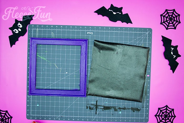Step-by-step guide on prepping the canvas for Halloween SVG decor by Fleecefun