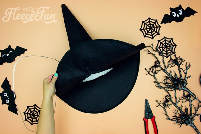 Showing sire being threaded around the brim of the witch hat. Learn how to make a witch hat with this free pdf pattern and step by step tutorial. This couture style hat is sure to be a favorite year after year.