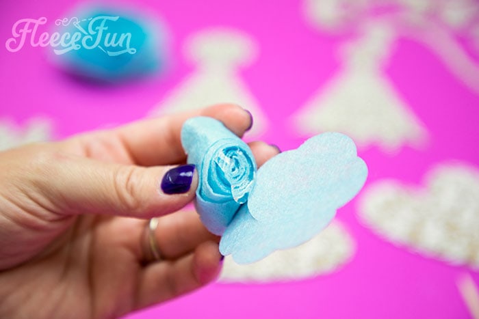 adding glue to the flower