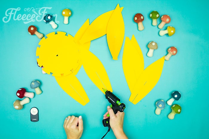 adding glue. This Giant Paper Sunflower DIY (FREE SVG files) is perfect for fall! Make a Giant flower wall or use it to decorate your space! So many possibilities!