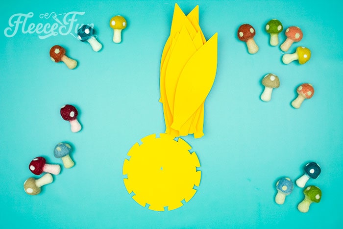 all petals made. This Giant Paper Sunflower DIY (FREE SVG files) is perfect for fall! Make a Giant flower wall or use it to decorate your space! So many possibilities!
