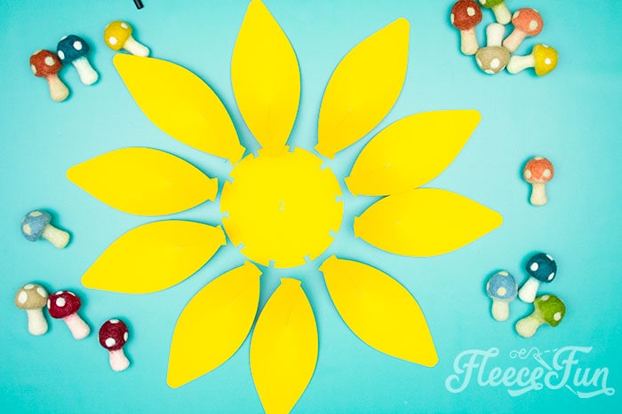 2nd row with petals to glue on. This Giant Paper Sunflower DIY (FREE SVG files) is perfect for fall! Make a Giant flower wall or use it to decorate your space! So many possibilities!