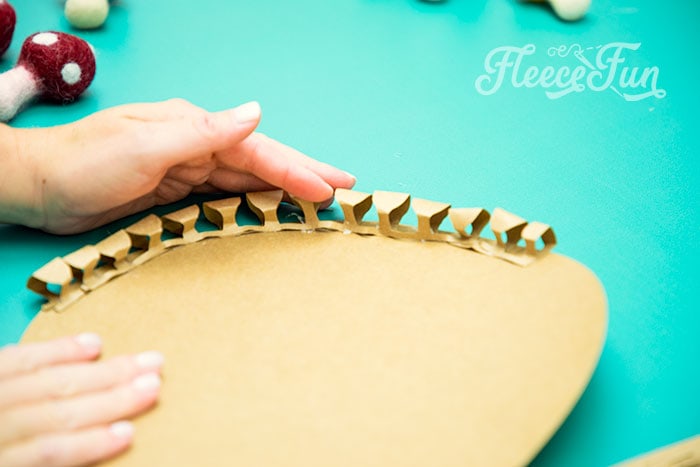 Use your fingers to get the paper to have a more rounded look at the top. Afterwards, continue in this method, spiraling all the way to the center.