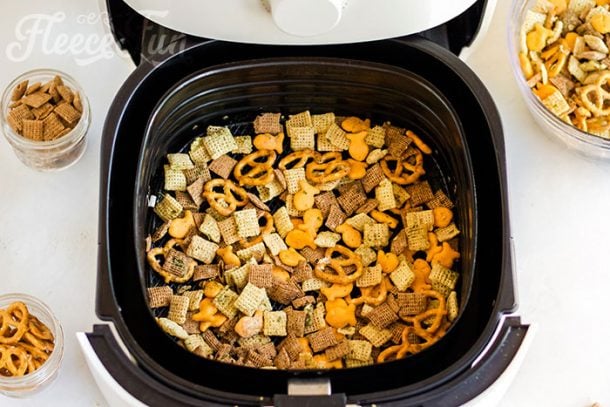 Placing the smack mix in the air fryer basket.