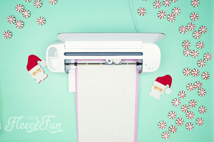 Start your Christmas craft by cutting out the felt Santa pattern from fleecefun's free template and tutorial.