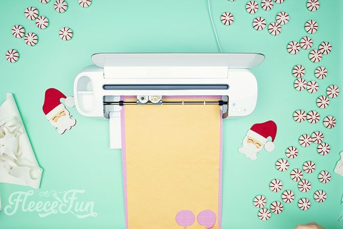 cricut maker cutting the ornament using the free svg files.