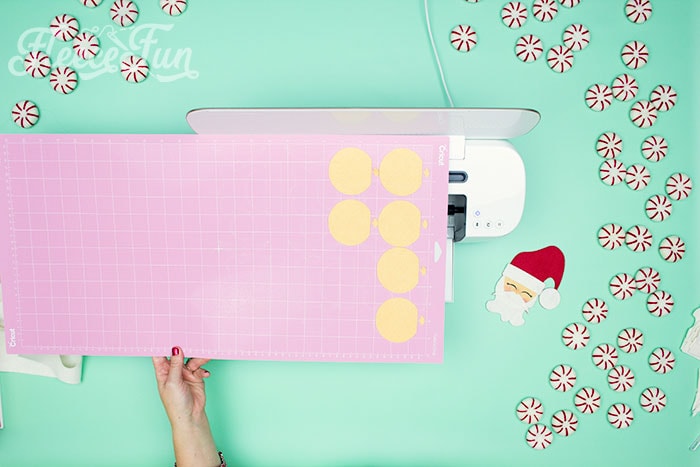 Start your Christmas craft by cutting out the felt Santa pattern from fleecefun's free template and tutorial.