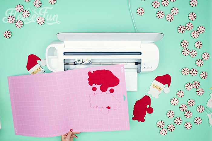 Start your Christmas craft by cutting out the felt Santa pattern from fleecefun's free template and tutorial.