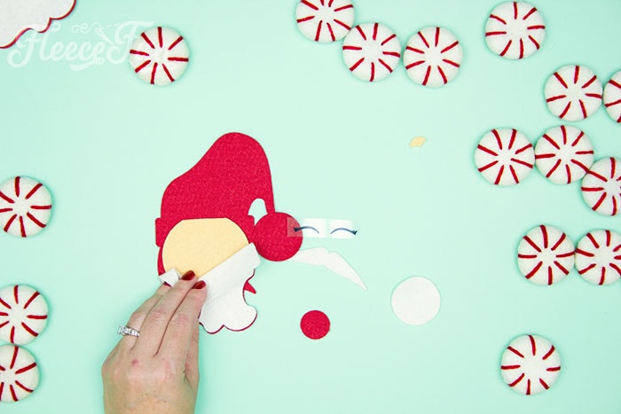 Adding eyes to the felt Santa ornament using fleecefun's free template and tutorial.