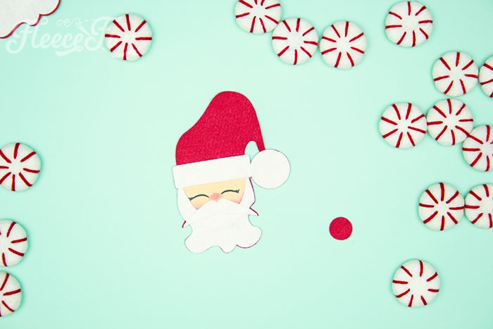 Final assembly of your handmade felt Santa decoration with fleecefun's free template and tutorial.