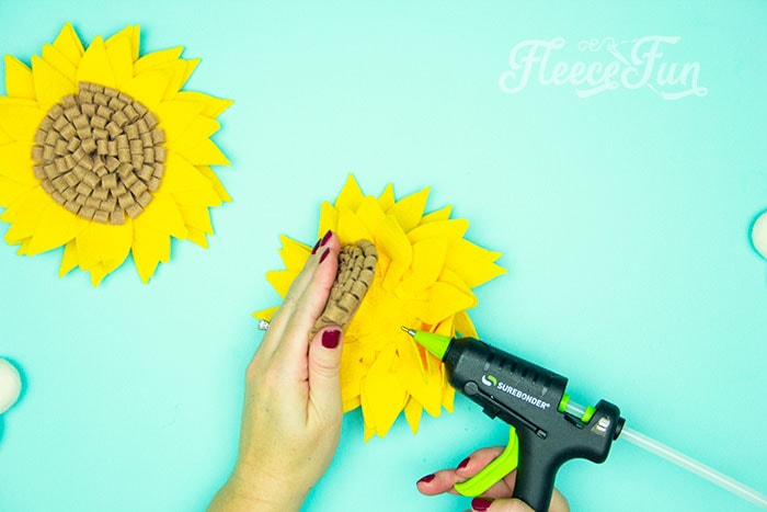 Finally glue the center into the center of the flower. DIY sunflower project with free SVG and template from fleecefun