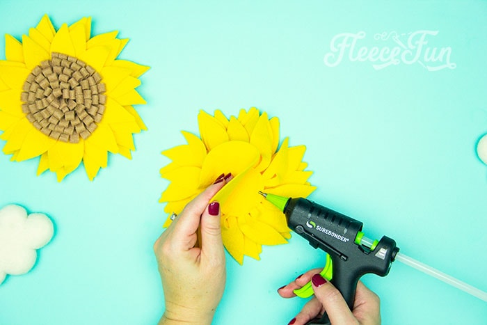 Glue each layer into place. Step-by-step tutorial for felt sunflower DIY from fleecefun