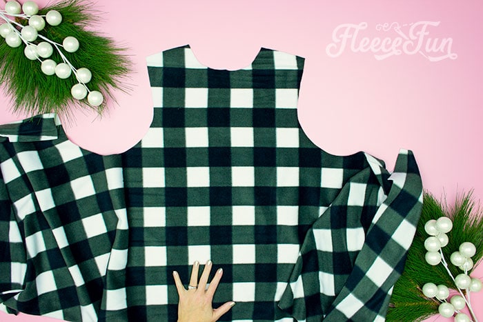 Unfold the vest piece so the back is in the center