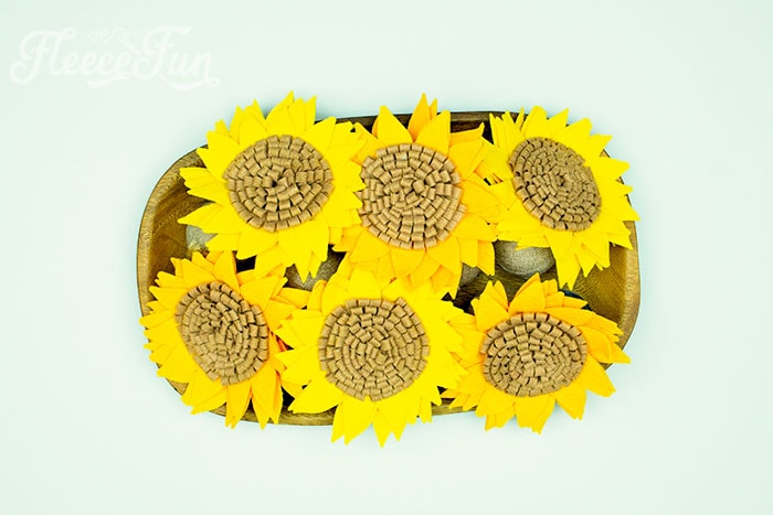 use felt flowers in wood tray for an easy centerpiece.