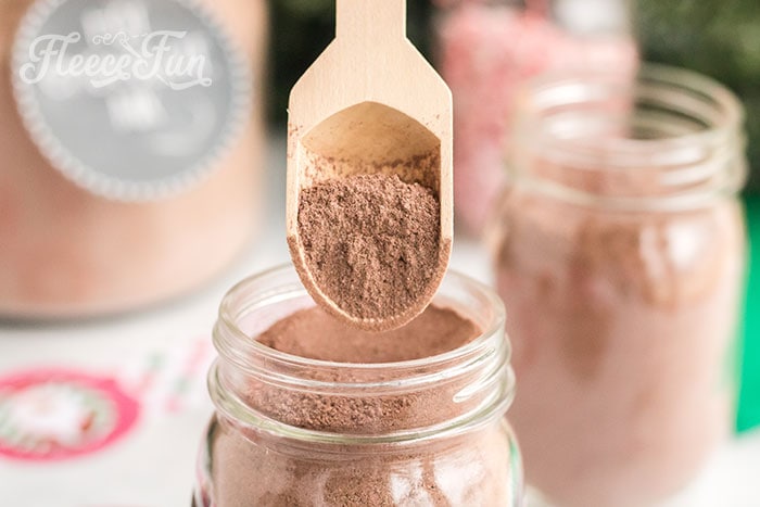 adding cocoa mix to your mason jar