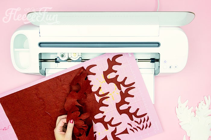 Prepare felt pieces for your Christmas reindeer ornament with the free fleecefun pattern