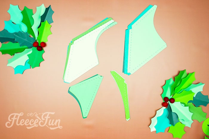 Cutting out holly leaf pieces with fleecefun's free template and tutorial.