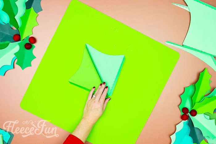 Gluing giant holly leaves together with fleecefun's free tutorial and template.