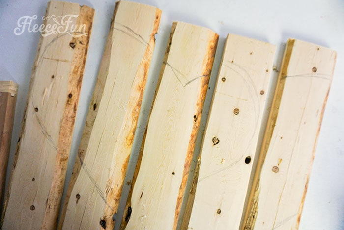 cutting out the heart from the pieces of wood