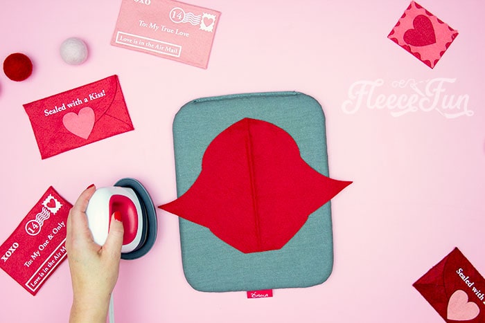 ironing out the creases for a Valentine envelope project inspired by fleecefun's step-by-step guide.