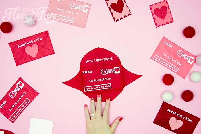 Assembling the felt Valentine envelope for a thoughtful gift, guided by fleecefun's free template.