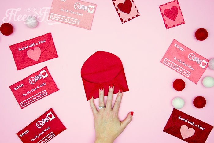 Attaching felt layers to complete a Valentine envelope project with fleecefun's free pattern.